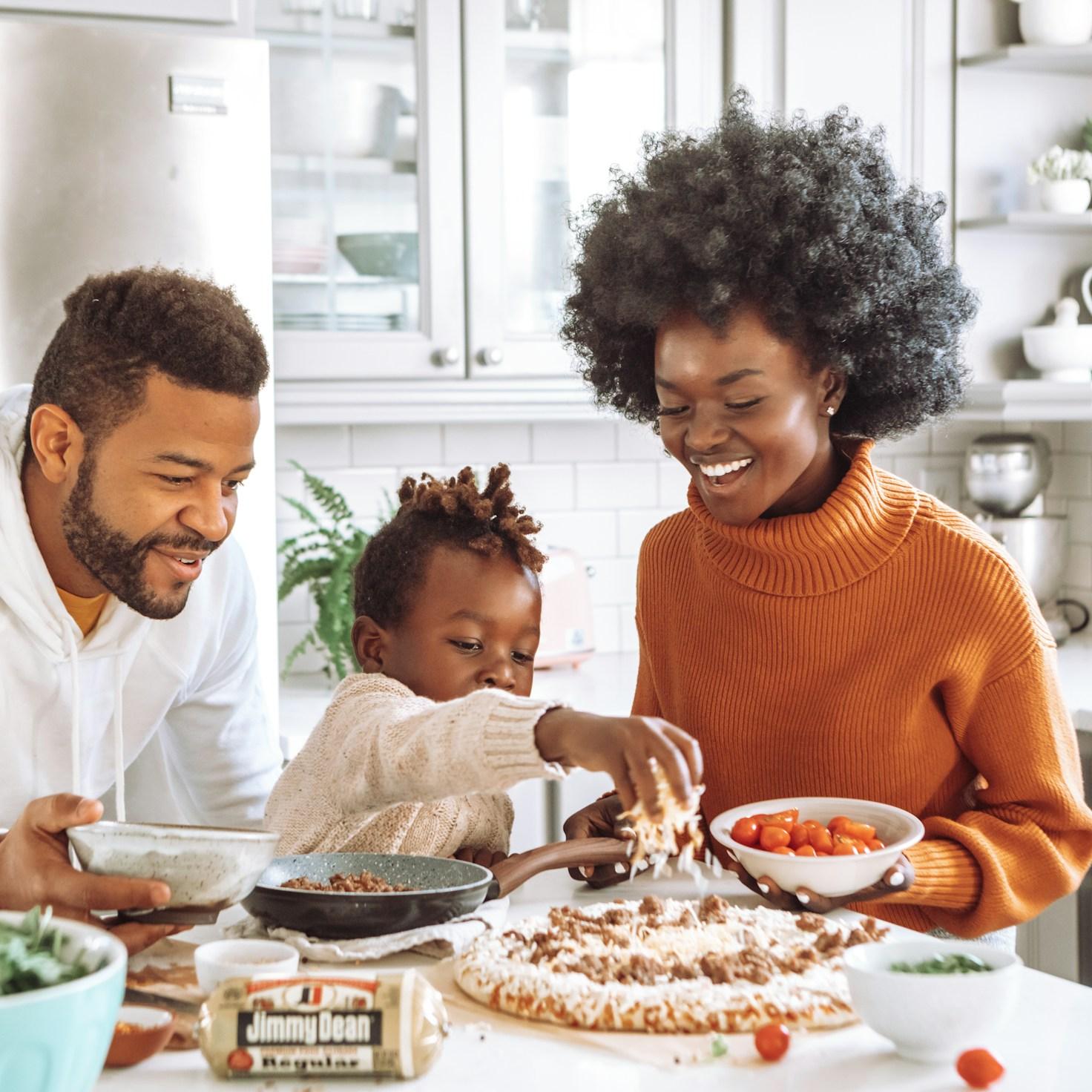 Community members working together in a modern kitchen, sharing recipes and techniques